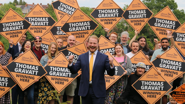 Thomas Gravatt with a crowd cheering